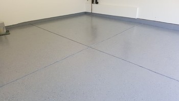 Painter painting garage floor in Cary